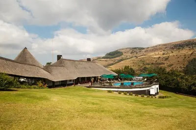 a resort with a large building with a swimming pool at Mount Sheba Rainforest Hotel - Mountain Spring Water in Pilgrimʼs Rest
