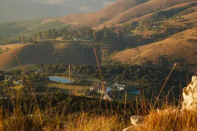 a view of a village in the hills at Mount Sheba Rainforest Hotel - Mountain Spring Water in Pilgrimʼs Rest