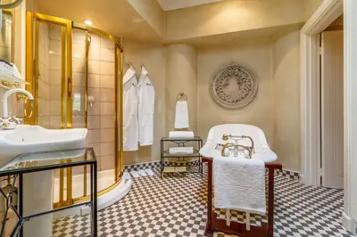 a bathroom with a tub and a sink at Serra Azul Lodge in Hazyview