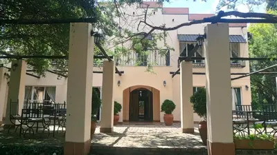 an entrance to a house with a courtyard at Valley of the Rainbow Fly Fishing Estate in Dullstroom