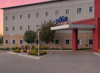 a building with a basketball hoop in front of it at Park Inn by Radisson Polokwane in Polokwane