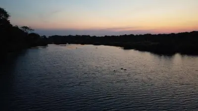 a view of a river at sunset at River Hill Lodge in Komatipoort