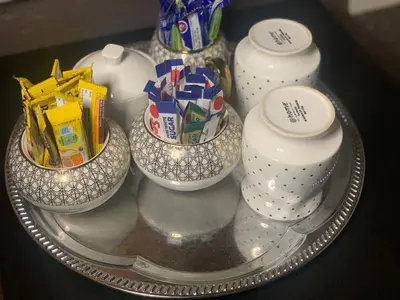 a glass tray with three bowls with presents in them at Oleratong Guest House in Evander
