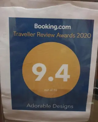 a sign for a travel review awards with at Adorable Designs in Pretoria