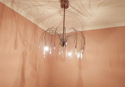a chandelier hanging from a ceiling in a room at Adorable Designs in Pretoria