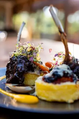 two pieces of food on a plate on a table at Karongwe - Becks Safari Lodge in Hoedspruit