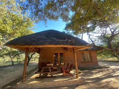 a small hut with chairs and a roof at Kigeni Safari Lodge & Spa in Vaalwater