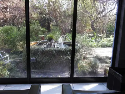 a view of a fountain from a window at Willow Place Guest House in Midrand