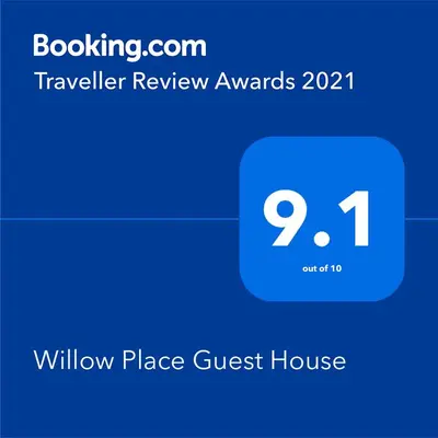 a screenshot of a toll free guest house with a blue phone at Willow Place Guest House in Midrand