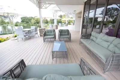 a patio with a couch and chairs and a table at Oxbow Country Estate in Erasmus