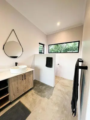 a bathroom with a sink and a mirror at 24 Degrees South Country Estate in Hoedspruit