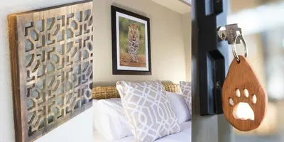 a bedroom with a bed with a wooden head board at Bushbaby River Lodge in Hoedspruit