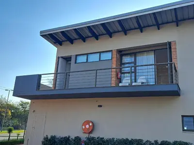a balcony on the side of a house at Alpine Attitude Boutique Hotel & Conference Venue in Pretoria