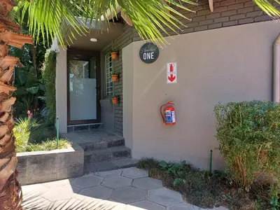 a building with a one sign on the side of it at Alpine Attitude Boutique Hotel & Conference Venue in Pretoria