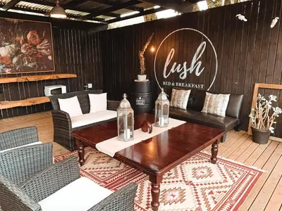 a dining room with a table and chairs at Lush in Graskop