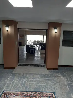a living room with a couch and a table at Hazyview Bogarts Villa in Hazyview