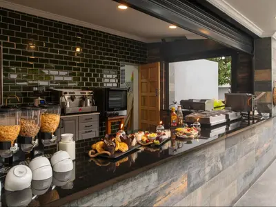 a kitchen with a buffet of food on a counter at Familia Guesthouse & Boutique Hotel in Groblersdal
