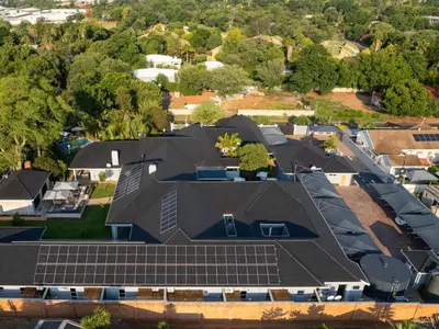 an overhead view of a house with solar panels on the roof at Familia Guesthouse & Boutique Hotel in Groblersdal