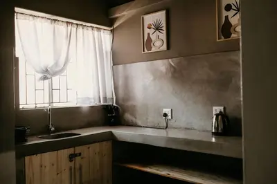 a kitchen with a sink and a window at Overnight Stop Before Kruger National Park in Phalaborwa