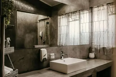 a bathroom with a white sink and a mirror at Overnight Stop Before Kruger National Park in Phalaborwa