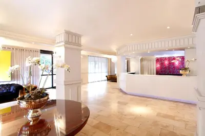 a living room with a lobby with a table at Manhattan Hotel in Pretoria