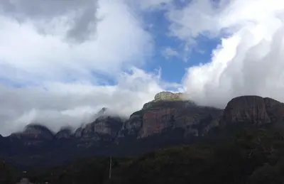 a mountain range with clouds on top of it at Ukuthula Hideaway in Kampersrus AH