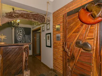 an entrance to a room with a wooden door at Sunrock Guesthouse in Kempton Park