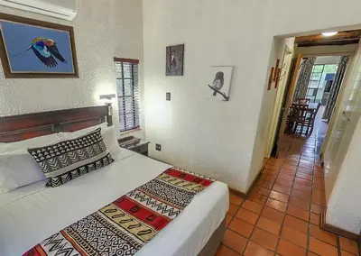 a bedroom with a bed in a room at Burchell's Bush Lodge by Dream Resorts in Sabi Sand Game Reserve