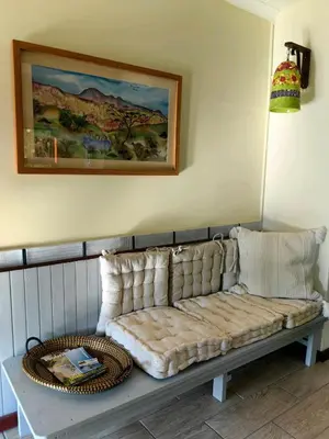 a couch sitting in the corner of a room at House of Art in Haenertsburg