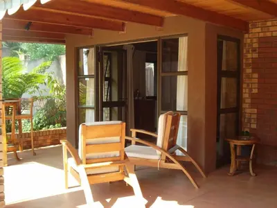 two chairs sitting on the porch of a house at Ku De Ta B&B in White River
