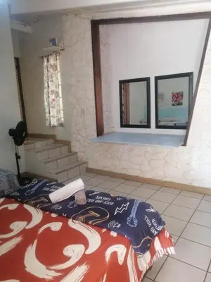 a bedroom with a bed and a window at BellaMaria in Pretoria