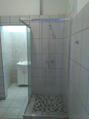a shower with a glass door in a bathroom at BellaMaria in Pretoria