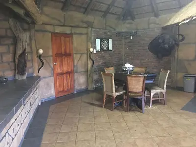 a dining room with a table and chairs at Baobab Lane Lodge in Marnitz