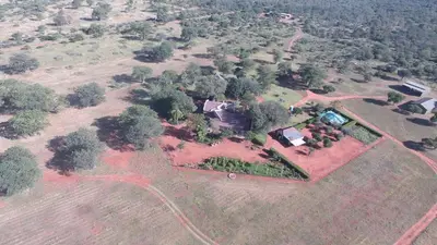 an aerial view of a house in a field at Baobab Lane Lodge in Marnitz