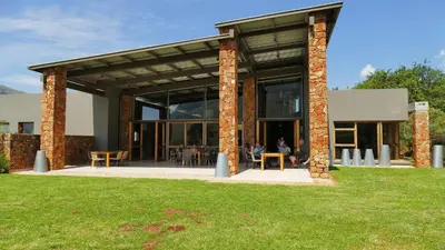 a building with a large group of people in it at Verlorenkloof in Dullstroom