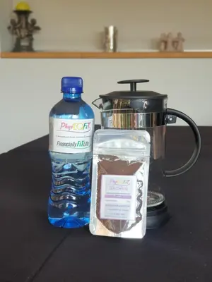 a bottle of water and a container of food next to a blender at PhysEQFiT Guesthouse & Spa in Centurion
