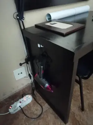 a desk with a nintendo wii game controller at The Shamrock Hotel in Polokwane