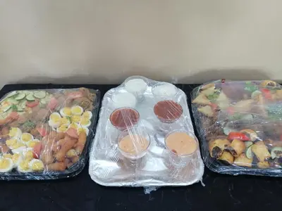 three plastic containers filled with different types of food at The Shamrock Hotel in Polokwane