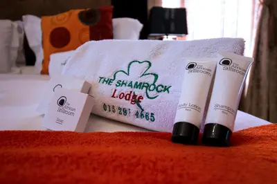a pile of products sitting on top of a bed at The Shamrock Hotel in Polokwane