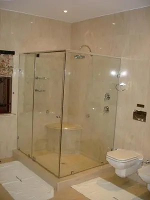 a bathroom with a shower and a toilet at Kosmos Manor Guest House in Hartbeespoort
