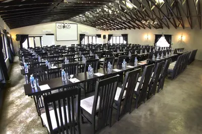 a large room with tables and chairs in it at Accolades Boutique Venue in Midrand
