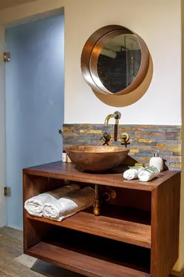 a bathroom with a bowl sink and a mirror at Bly B&B in Pretoria