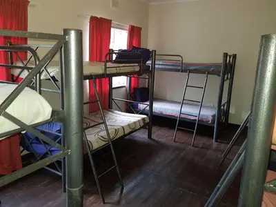 a group of bunk beds in a room at Travel Lodge Sabie in Sabie