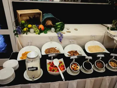 a table topped with plates and bowls of food at Midrand Conference Centre in Midrand