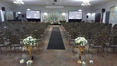 a room with a row of chairs with flowers at Midrand Conference Centre in Midrand