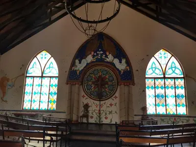 a church with three stained glass windows in it at Midrand Conference Centre in Midrand