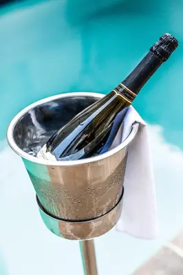 a whisk in a metal bucket on a table at Premier Hotel The Winkler in White River