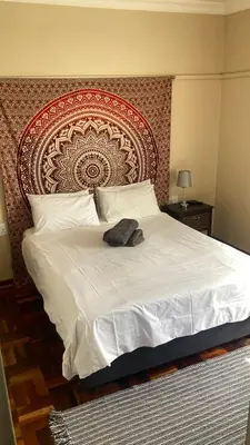 a bed with a headboard with a hat on it at 298 on 34th in Pretoria