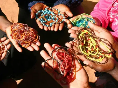 a group of people holding their hands in a circle at Madi a Thavha Mountain Lodge in Louis Trichardt