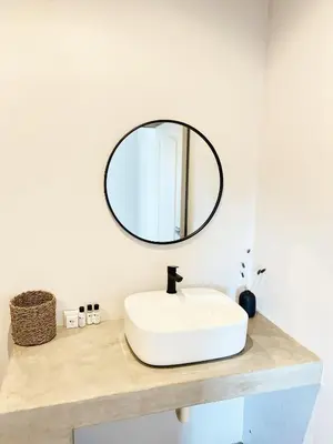 a bathroom with a white sink and a mirror at Lighthouse Guesthouse & Cafe in Groblersdal